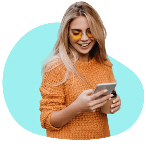 man in blue smiling and pointing to the right